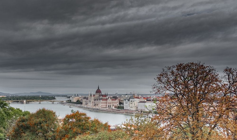 view of white and red dome building under gloomy skies