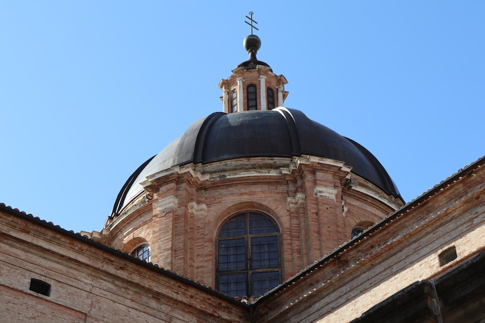 low-angle photography of gray concrete dome building during daytime