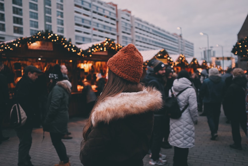 woman standing near people during daytime