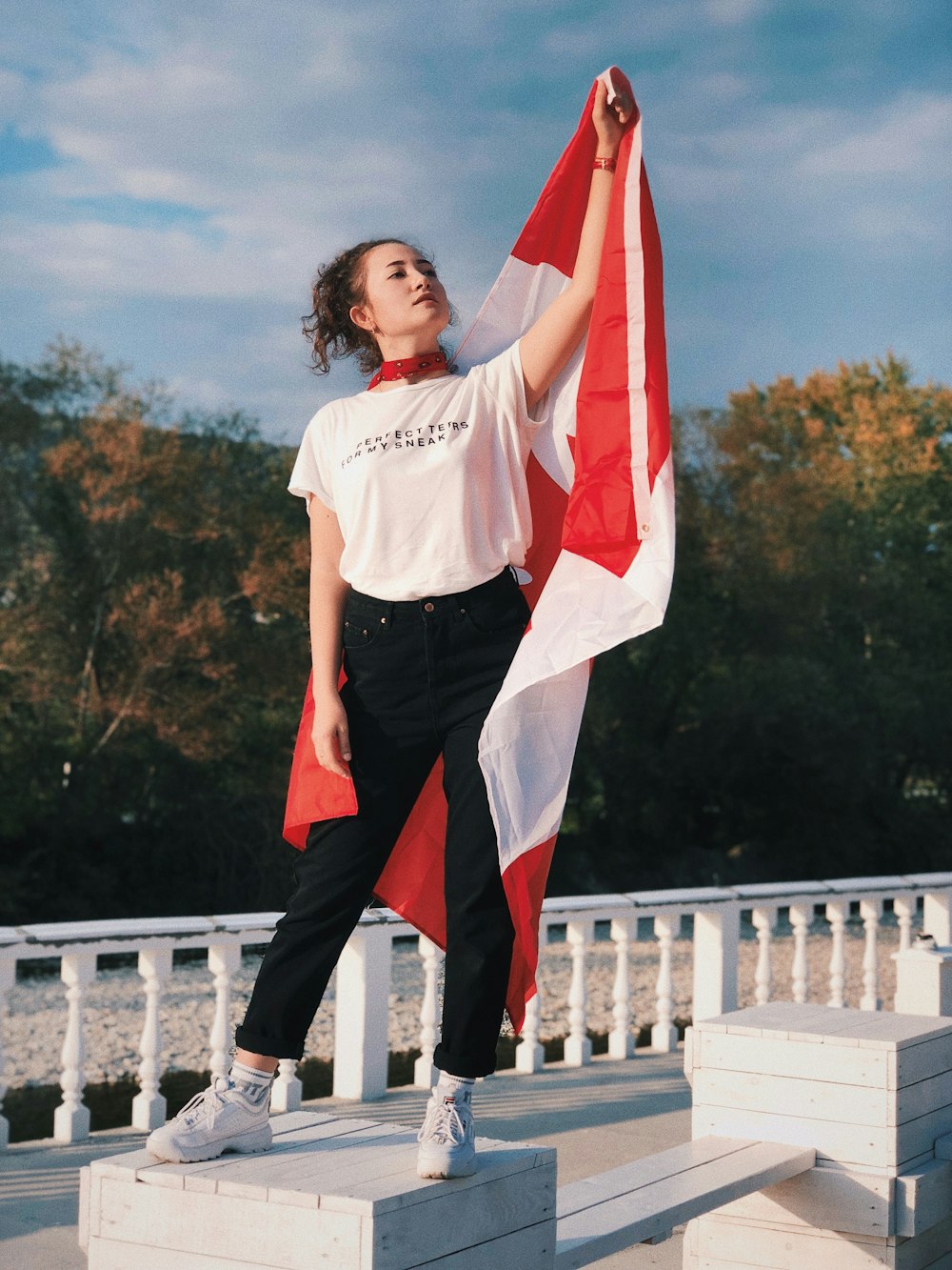 woman holding flag of Canada