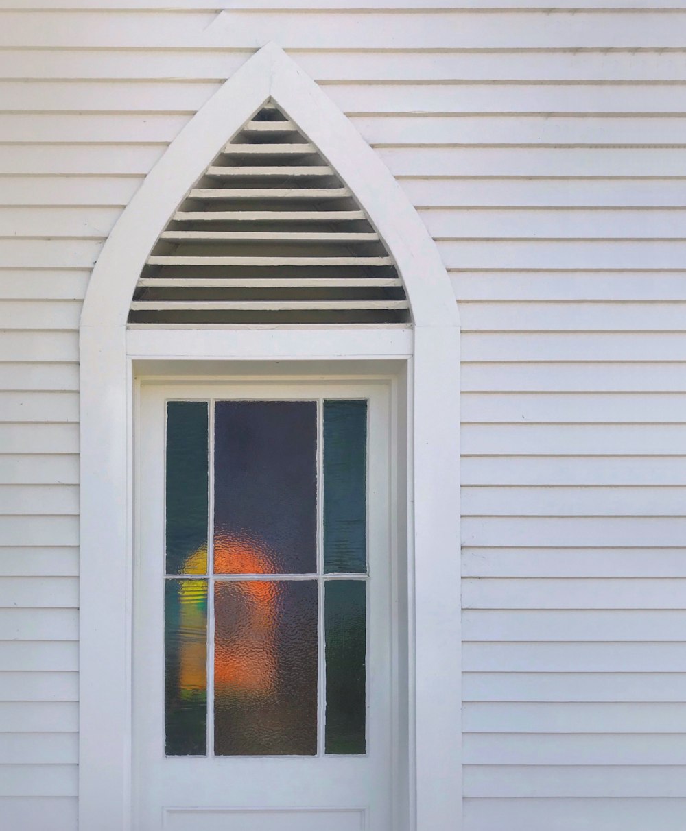 white wooden framed glass window