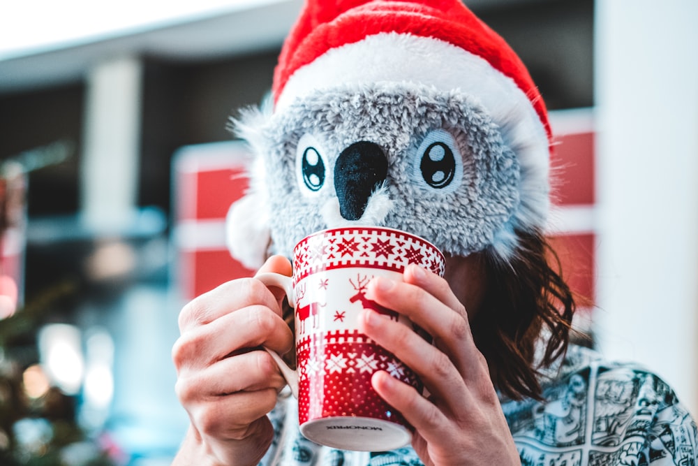 person holding mug