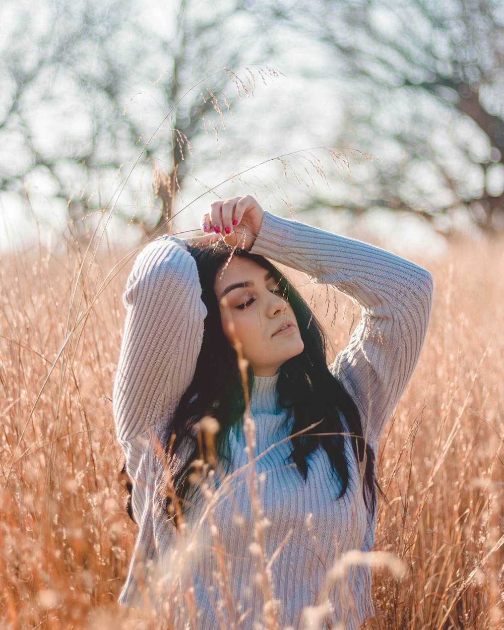 woman in the middle of the field