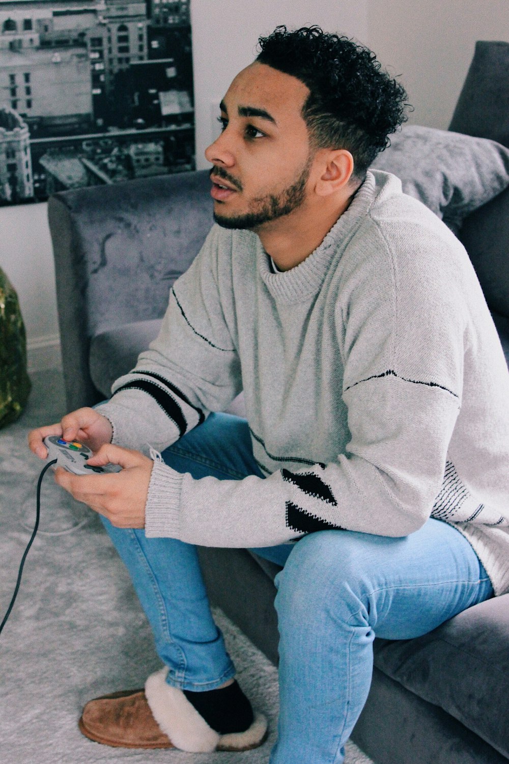 man sitting on sofa