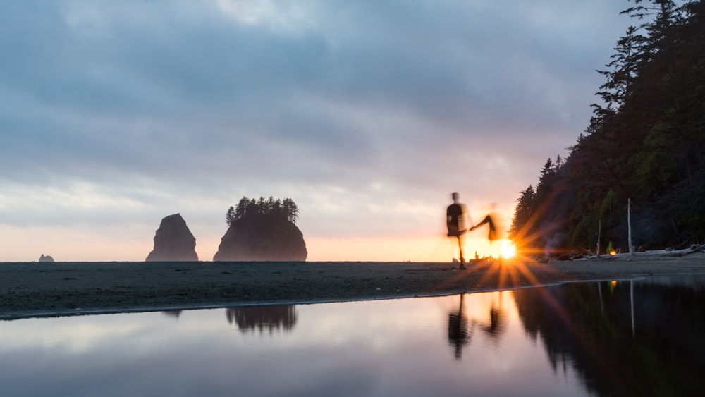 woman and man walking near sea