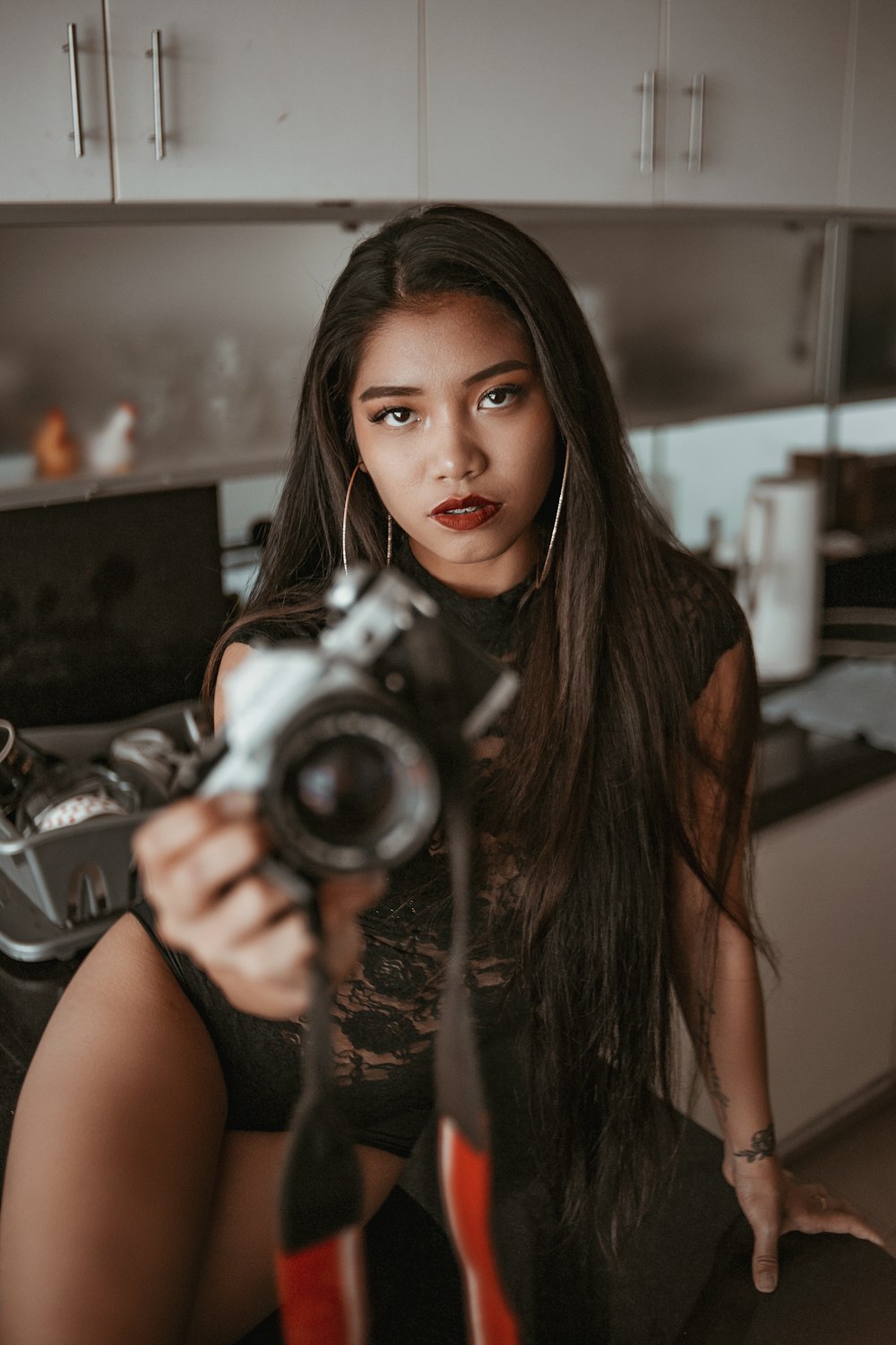 woman holding bridge camera