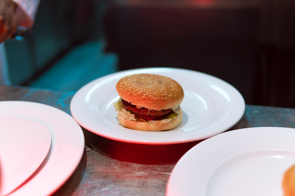 patty with bun on white plate