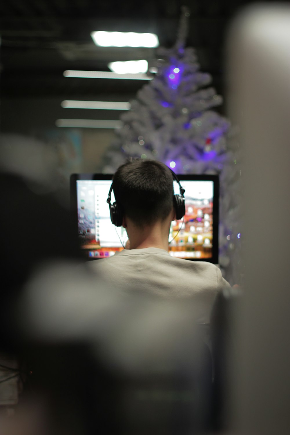 man using computer in selective focus photography