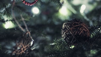 Close-up of rustic wooden ornaments hanging on a beautifully decorated Christmas tree