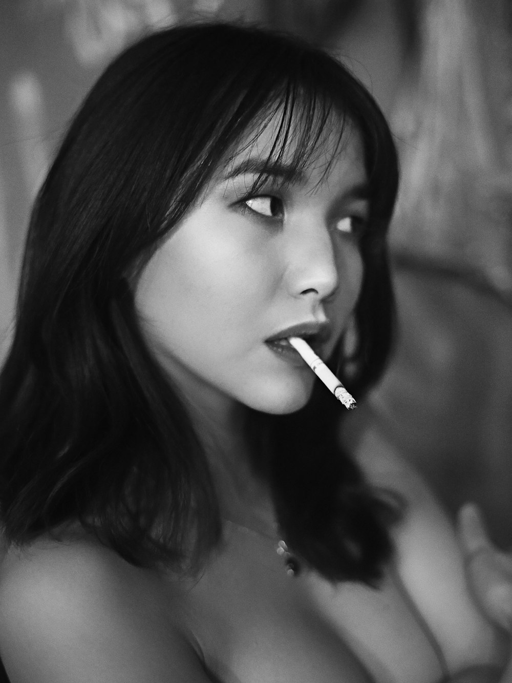 woman with cigarette on mouth