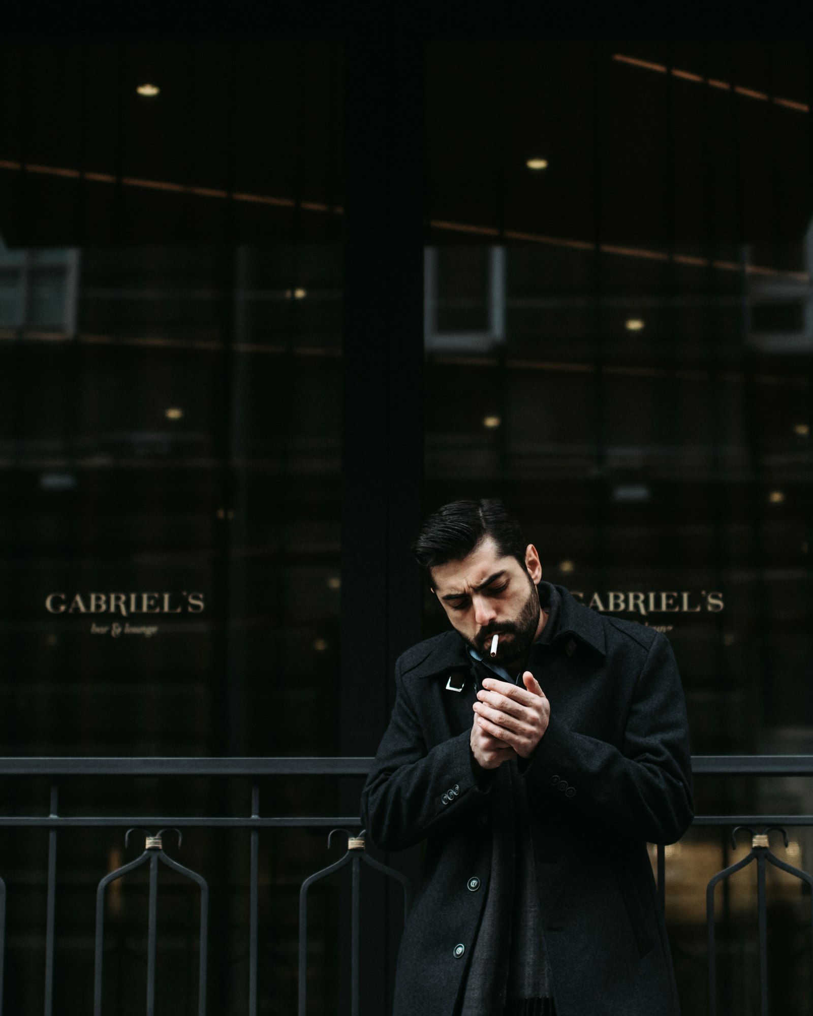 Nikon D5300 + Sigma 50mm F1.4 EX DG HSM sample photo. Standing man smoking cigarette photography