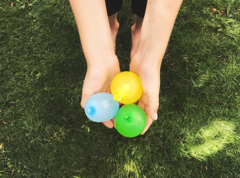 person holding balloons