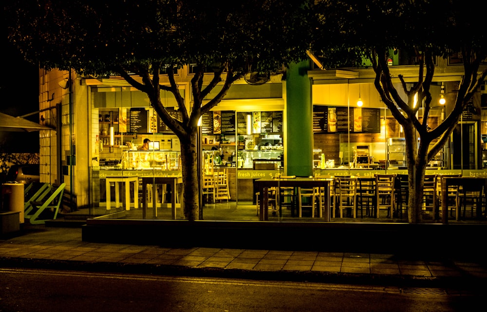 wooden chairs near trees