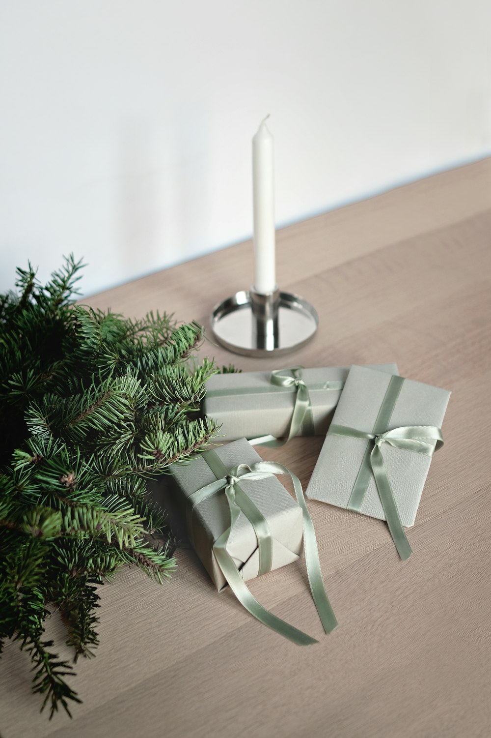 three gift boxes with ribbons on table