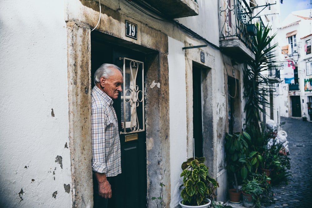 man standing on door