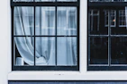Elegant window dressed with layered curtains and blinds