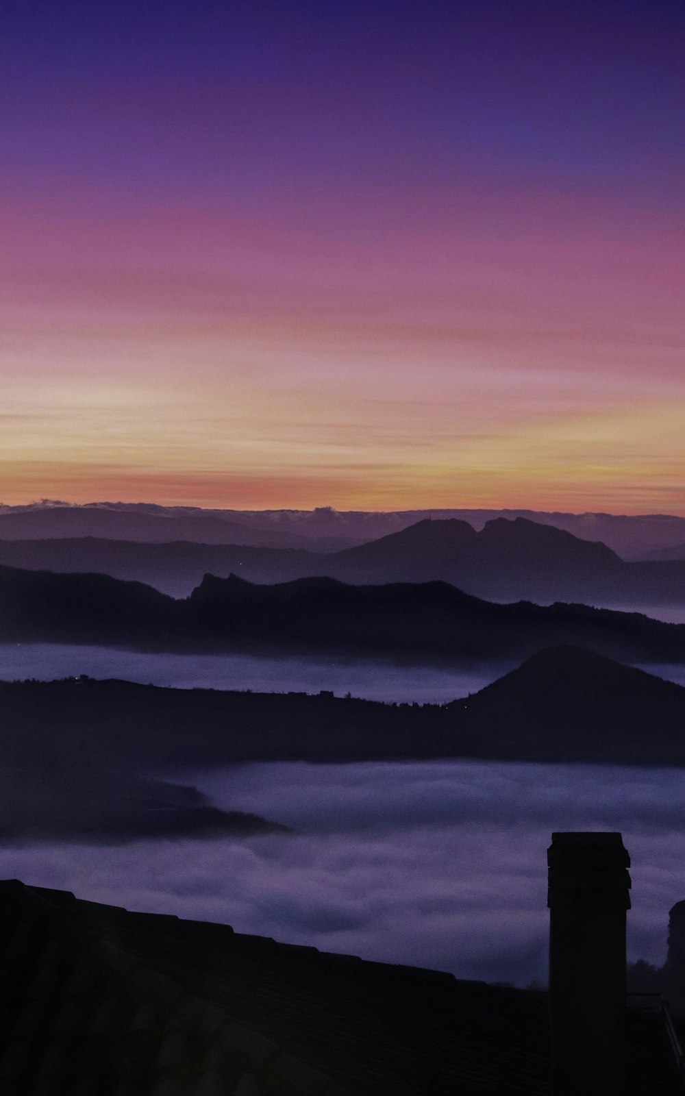 mountainous terrain covered with clouds