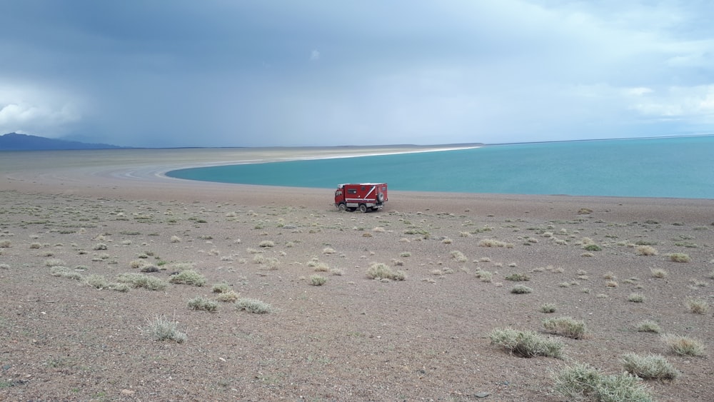 red truck on sand beach