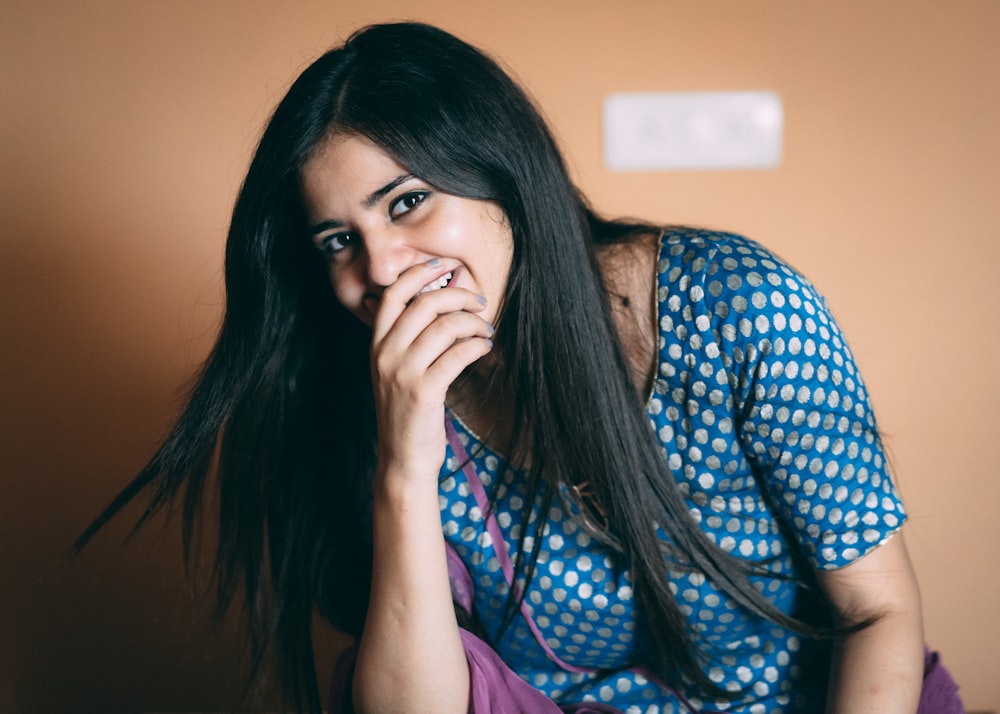 woman smiling while sitting