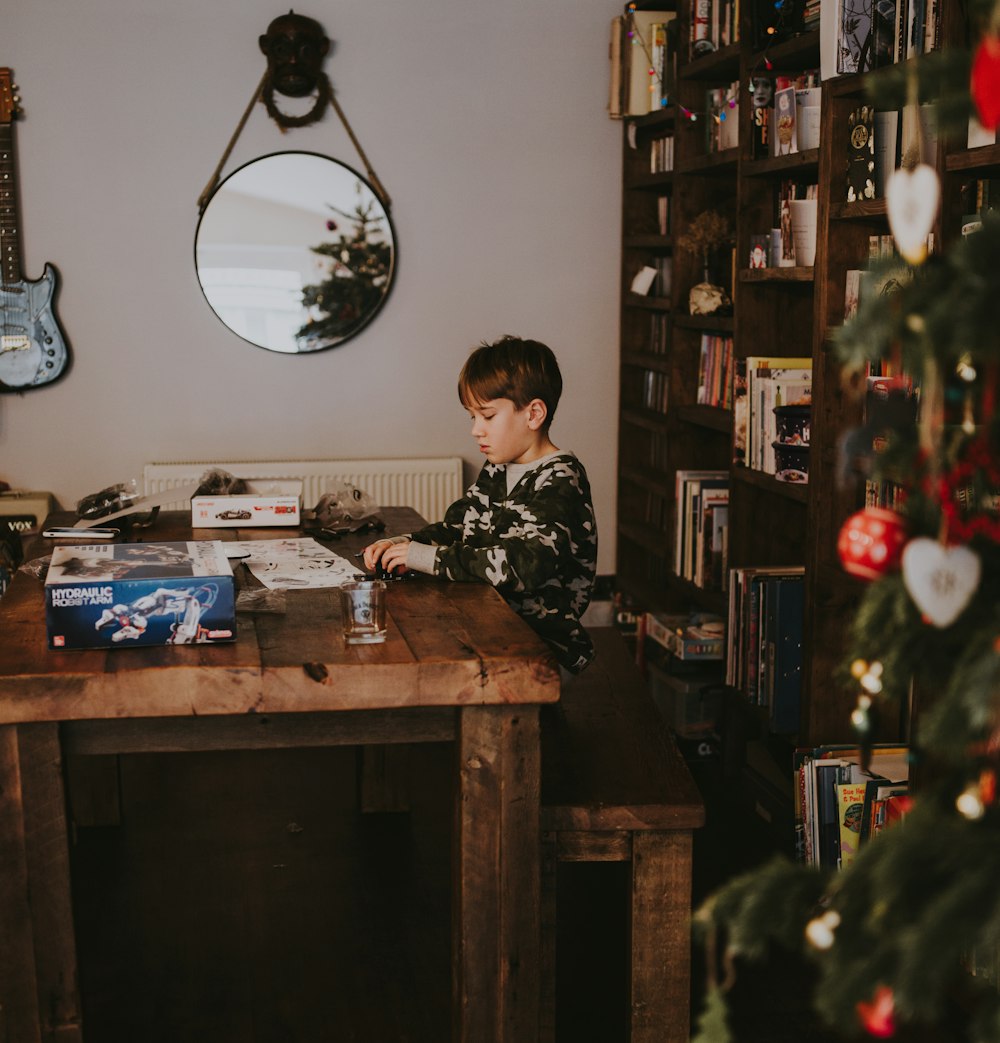 person sitting in front of brown wooden table