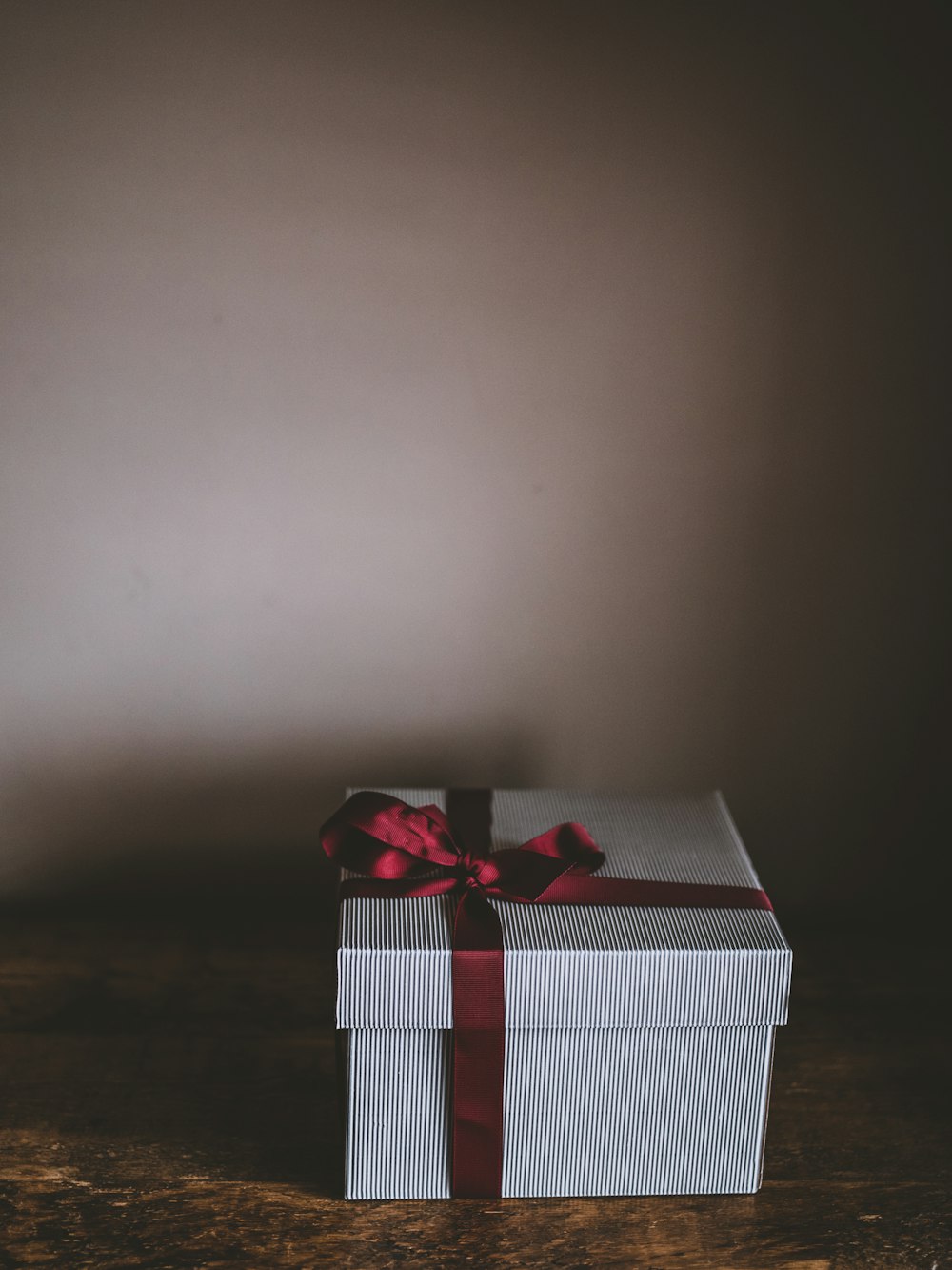 white box with red ribbon