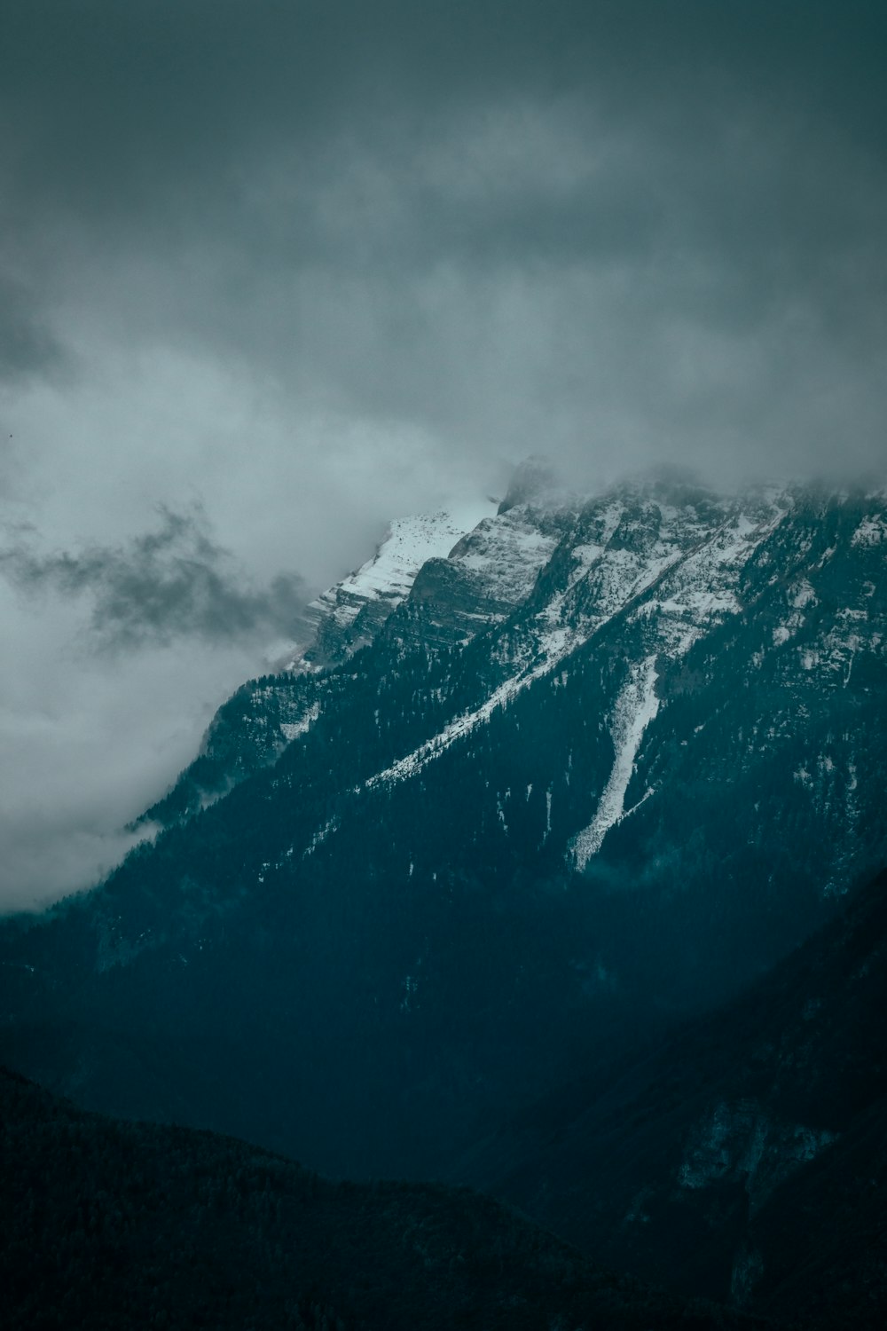 black mountain under white clouds