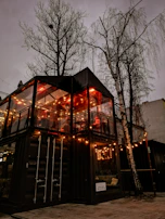 Stylish commercial container space illuminated by warm interior lighting at dusk