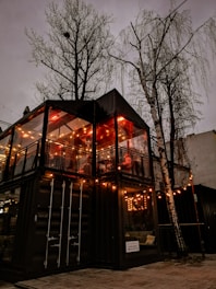 A modern container hotel set in a scenic outdoor environment.