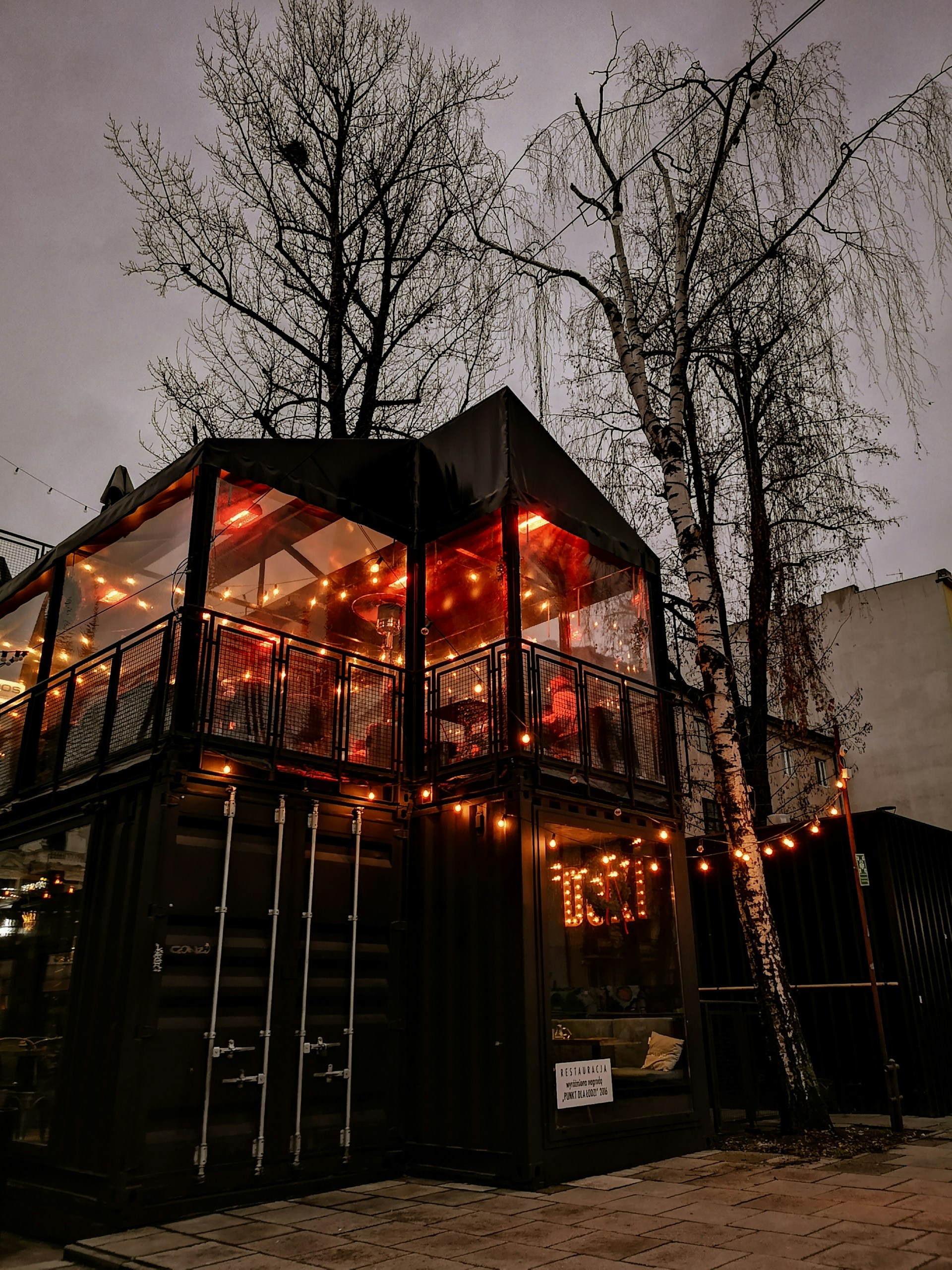 person wearing grey knit sweater