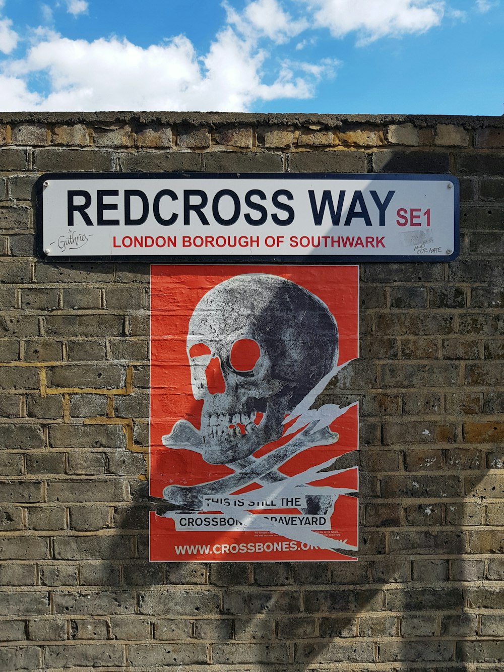 redcross way signage on concrete brick wal