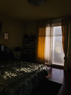 Quilted bed cover set spread neatly on a cozy bedroom bed with warm lighting