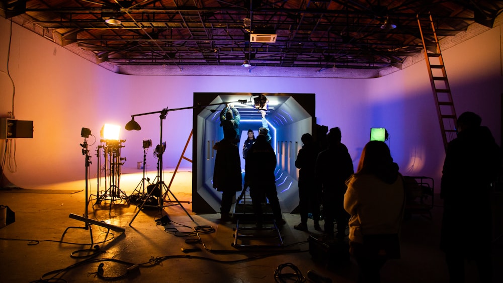 man standing beside softbox