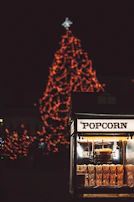 Festive popcorn machine with colorful lights in a lively party setting