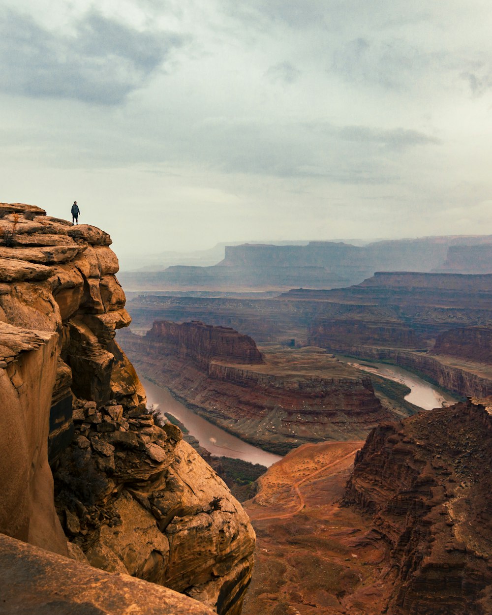 man standing on cliff