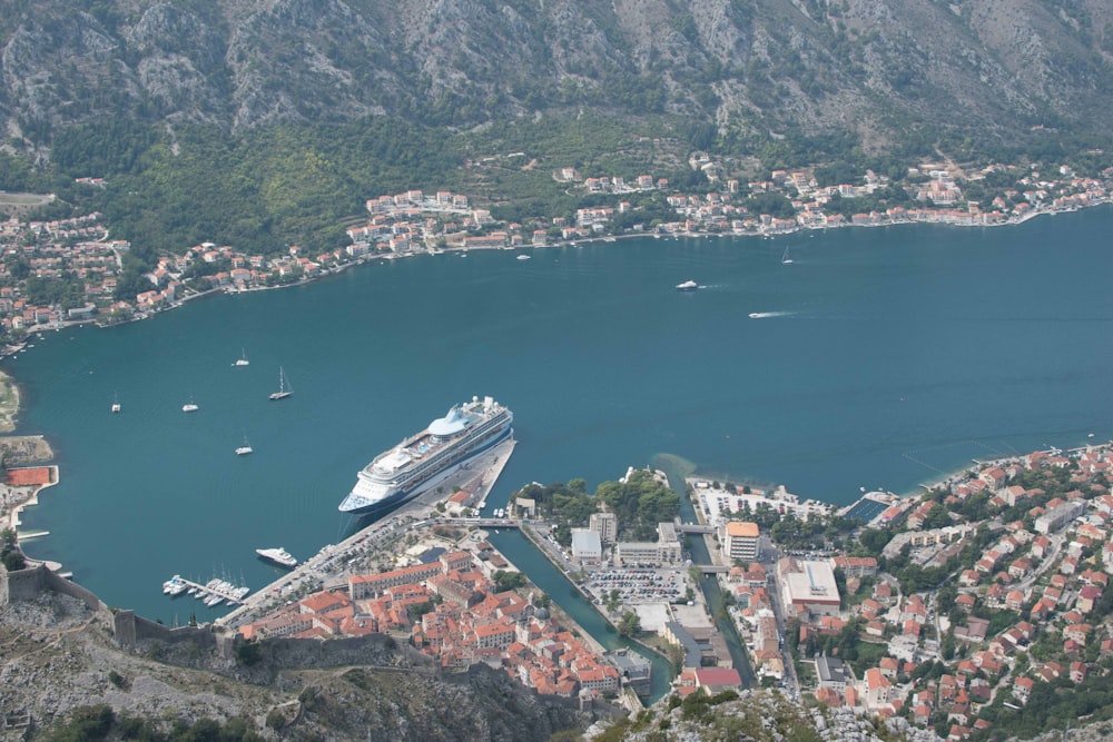 aerial photography of buildings beside calm water