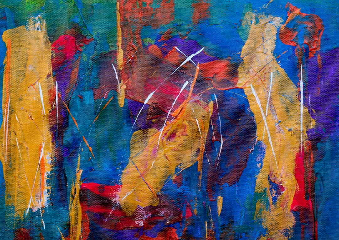 yellow, blue, purple, red, and green abstract painting