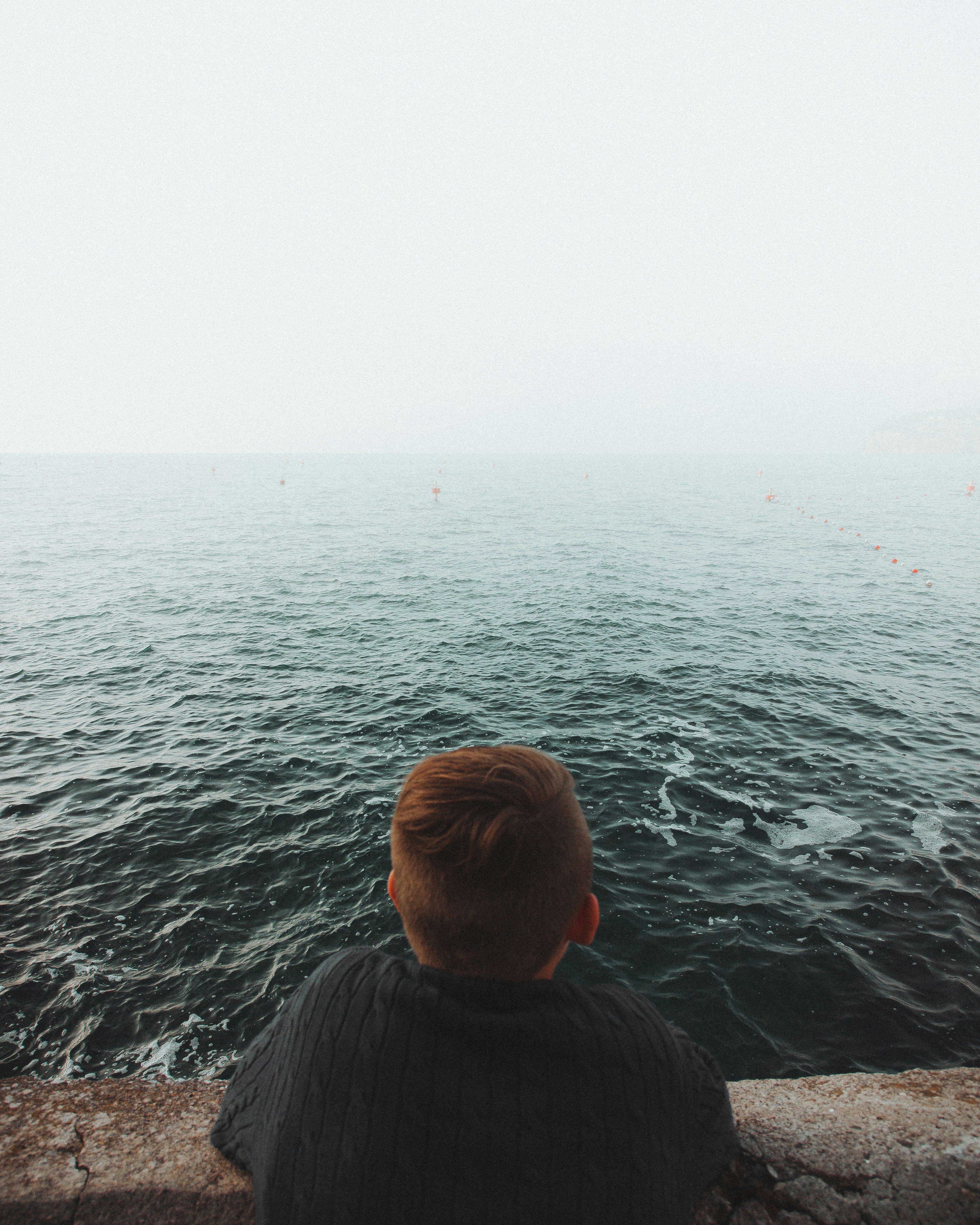 person looking at ocean during daytime