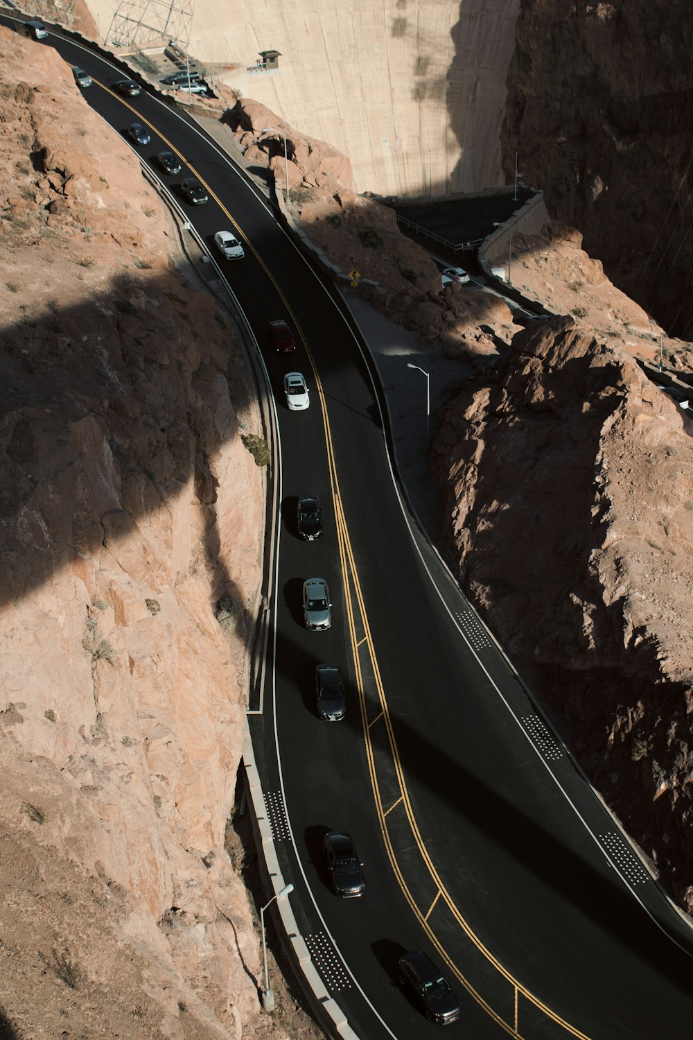 cars on left lane of road during daytimee