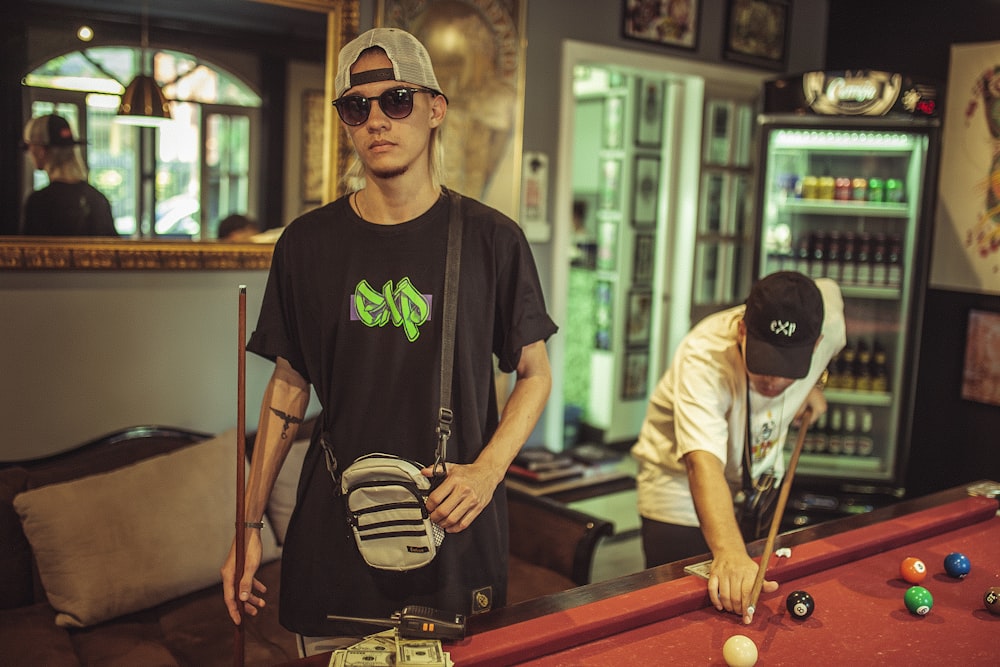 two men playing billiard