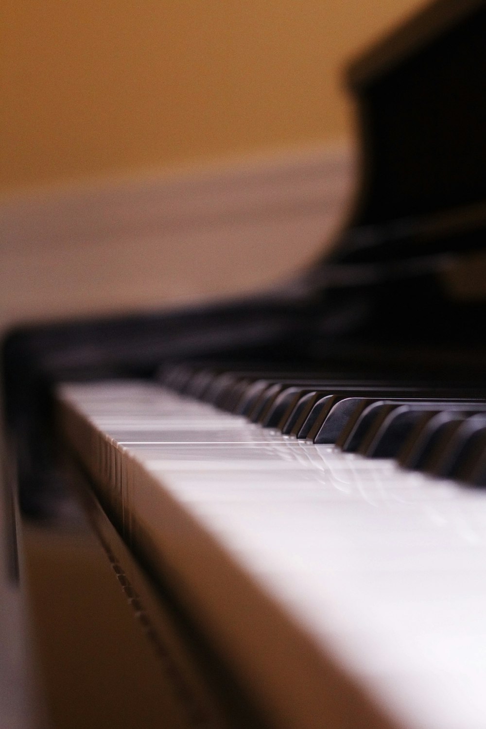 a close up of a black and white piano