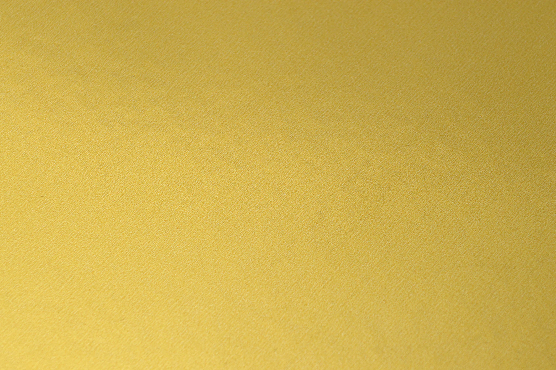 Close-up of textured golden zari fabric