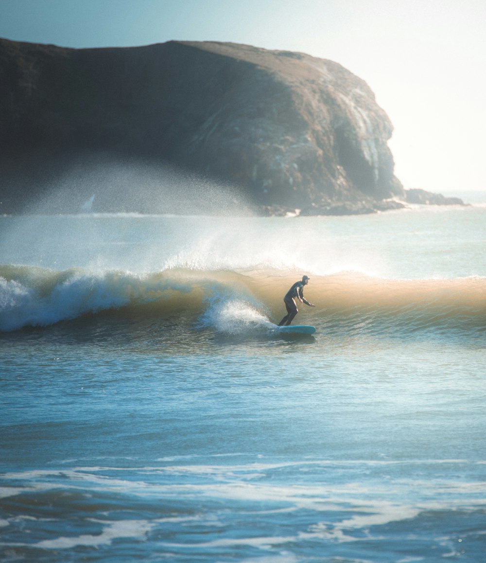 person surfing during daytime