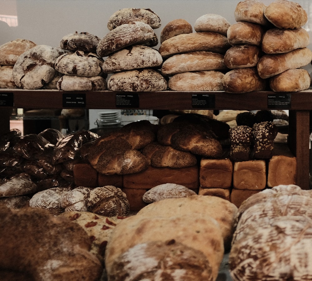 baked breads on brown wooden rack