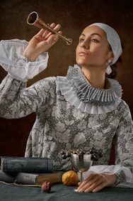 man in white lace long-sleeved shirt holding trumpet