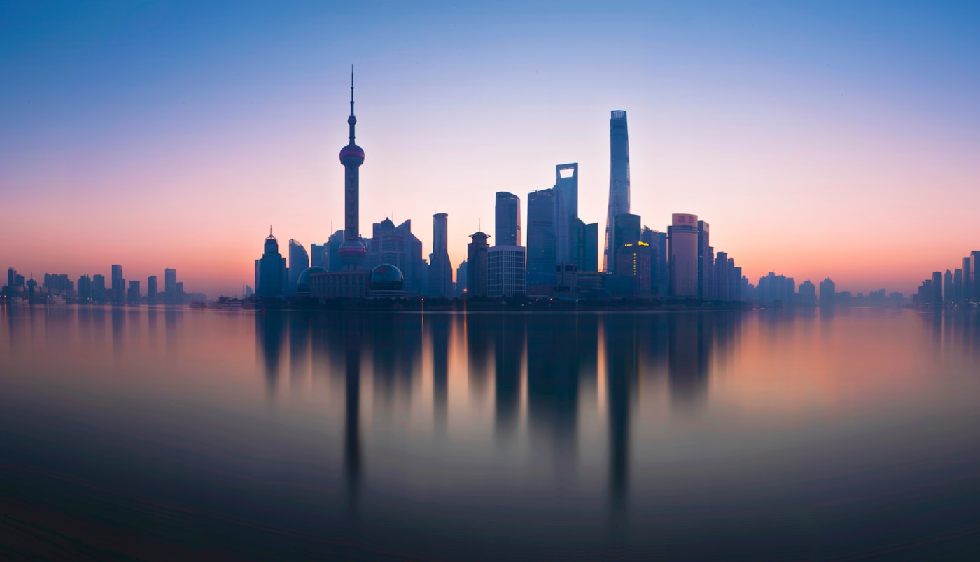 Shanghai Pudong skyline at dusk — the commercial hub where foreign brands transition from distributor models to direct operations