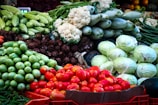 A colorful arrangement of fresh vegetables in a market setting.