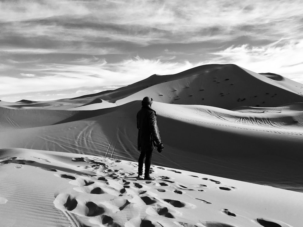 person standing on desert