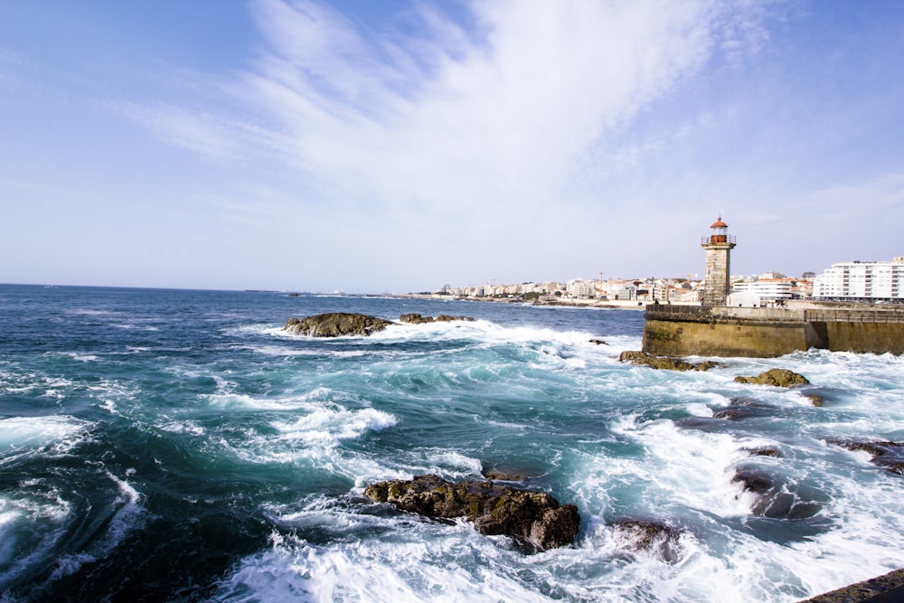 lighthouse near body of water