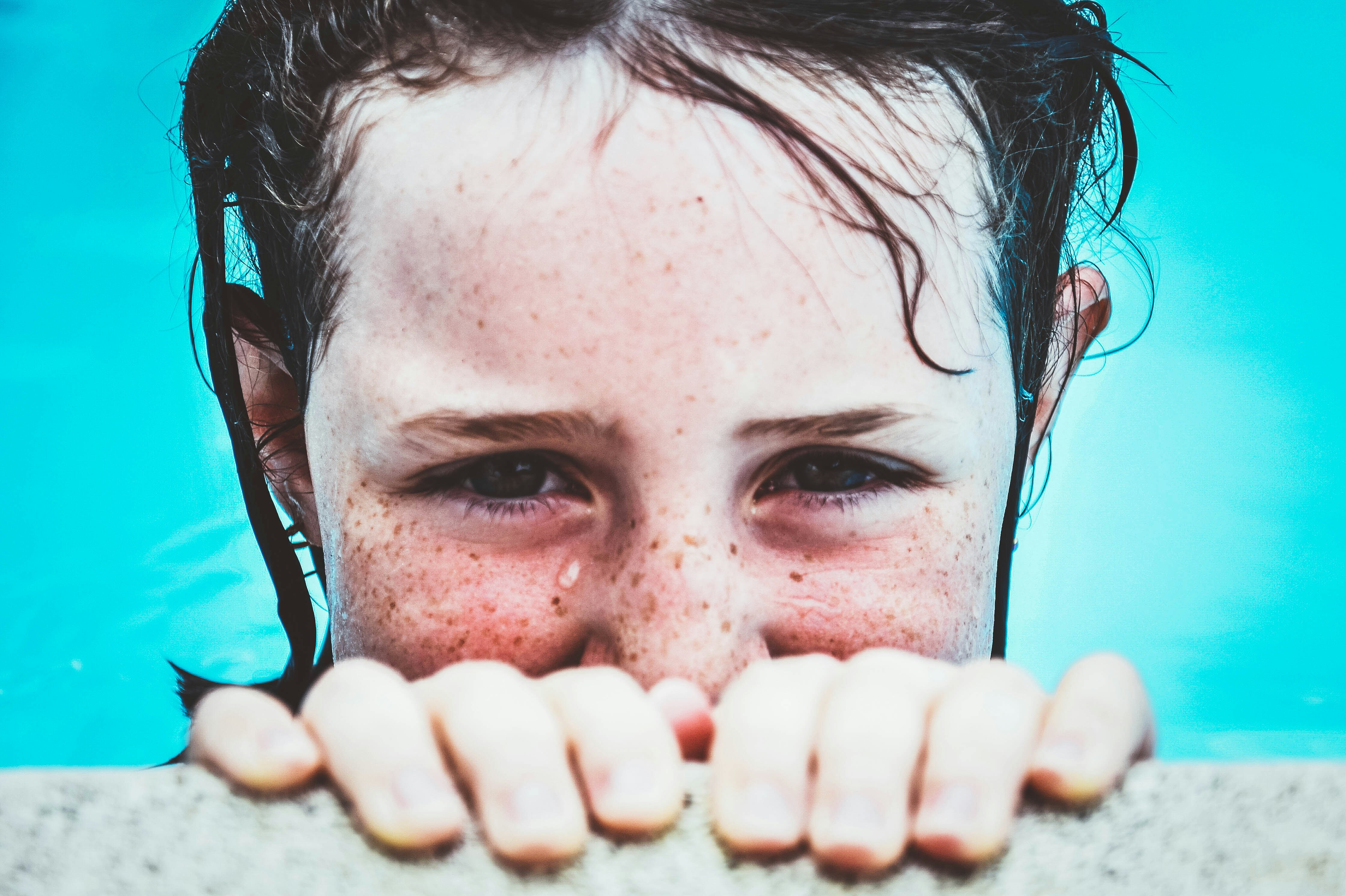 girl swimming on pool