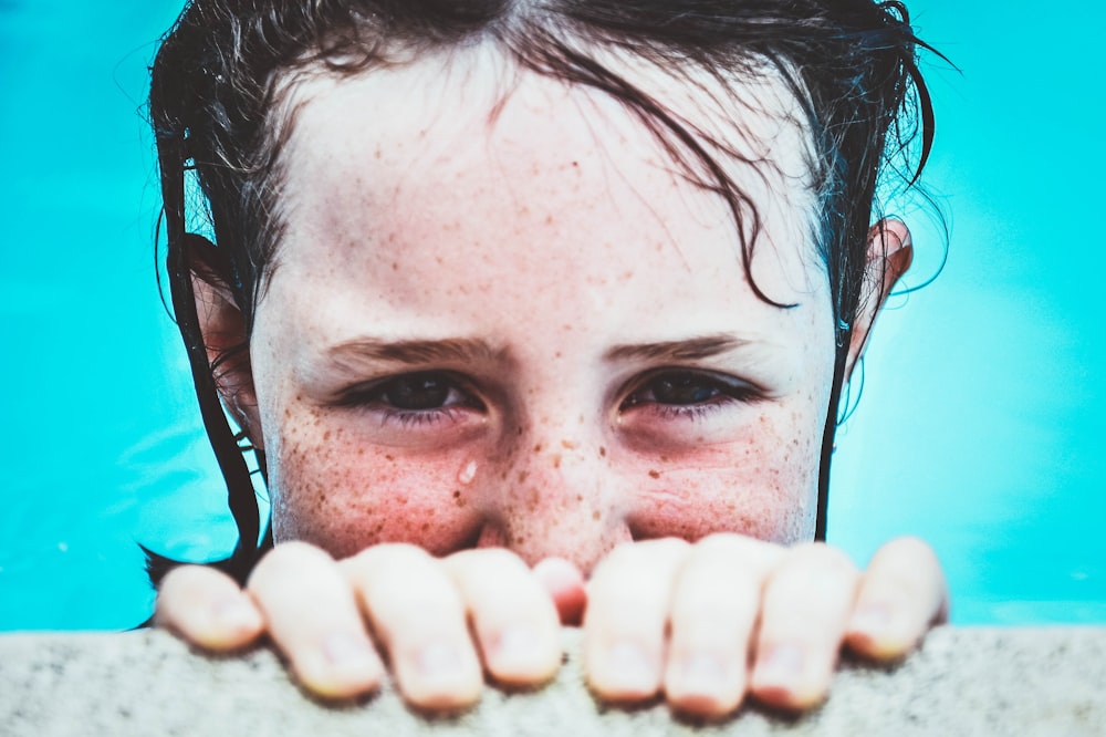 girl swimming on pool